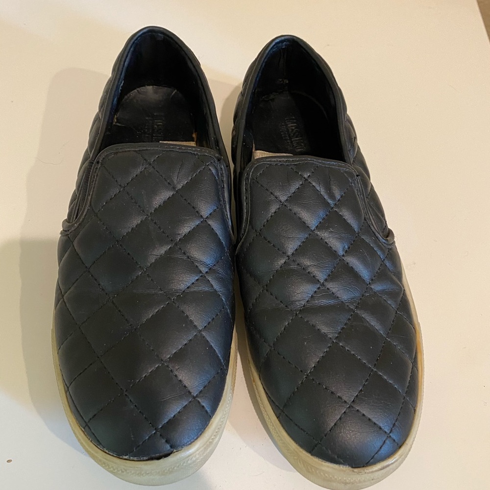 Black quilted slip on shoes